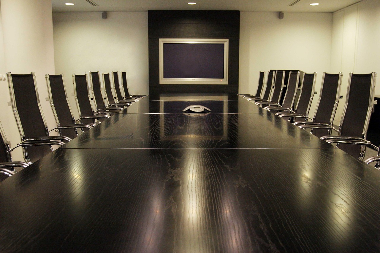 An elegant executive boardroom, representing the infrastructure a whole team can run on