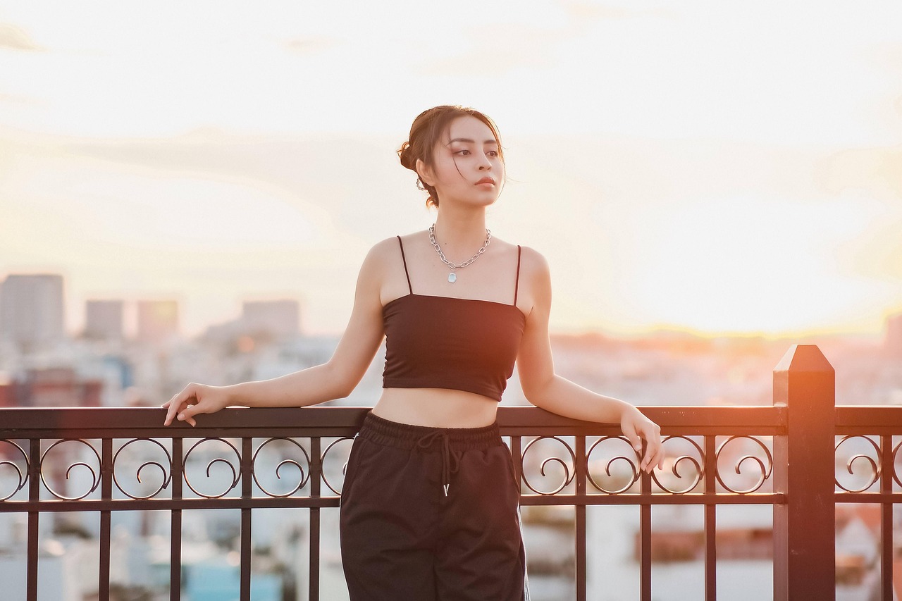 An elegant portrait against a city skyline at golden hour, representing personal financial freedom